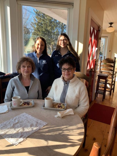 Women at table for National Muffin Day