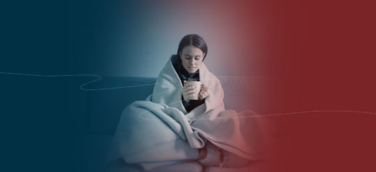 Woman bundled up in blanket