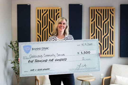 Carolyn S. McLaughlin, Development, Communications & Marketing Associate of Gateways Community Services, accepts the Q2 2025 Give-A-Click prize of $1,500.
