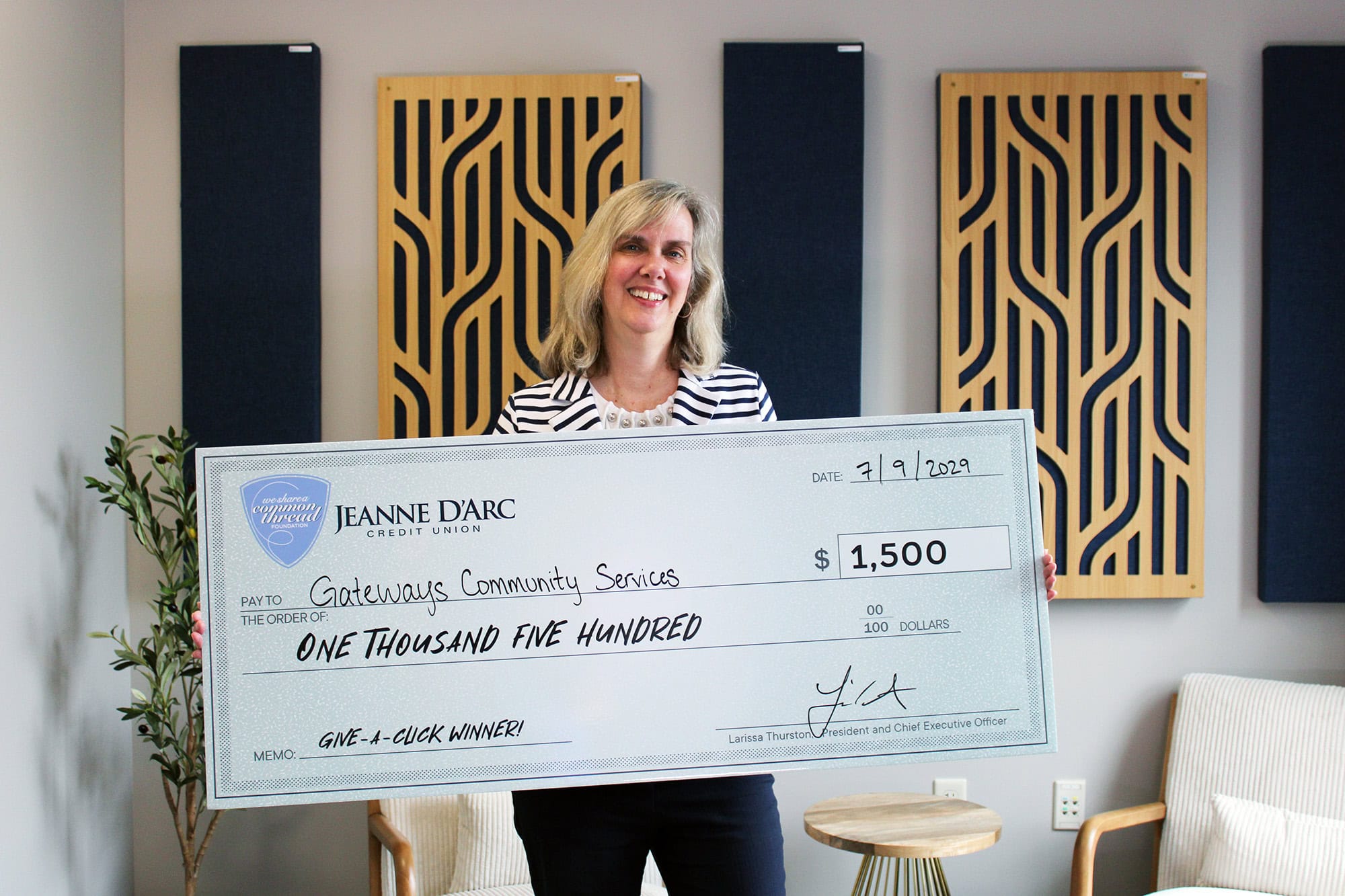 Carolyn S. McLaughlin, Development, Communications & Marketing Associate of Gateways Community Services, accepts the Q2 2025 Give-A-Click prize of $1,500.