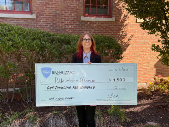 Amy Consalvi, President, Public Health Museum, accepts the Q3 2025 Give-A-Click prize of $1,500.