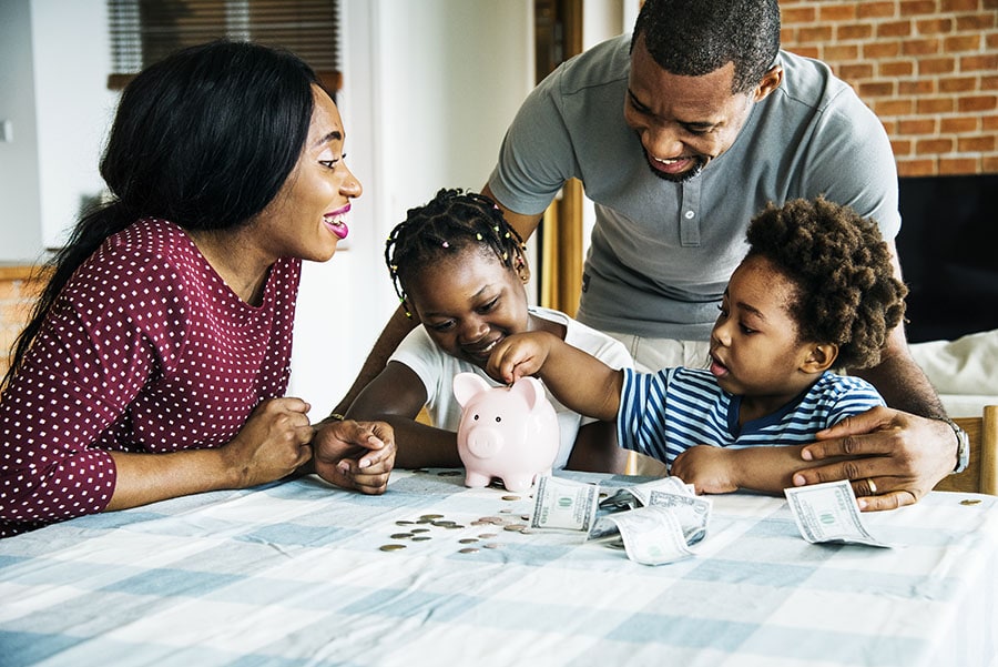 A family saves money together with a credit union high yield savings account.