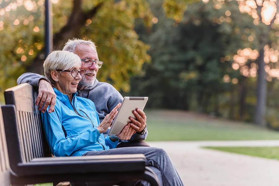 A senior couple researching SEP IRA rules on their tablet.