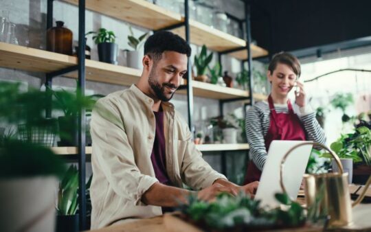 Small business owners managing operations in a retail shop