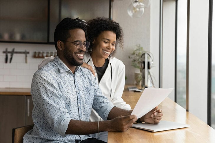 A couple is happy to see the statement showing their growing balance in their Certificate of Deposit.