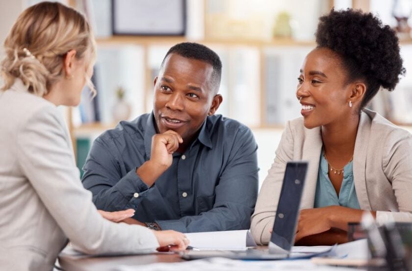 Investors in a commercial real estate deal discuss their investment.