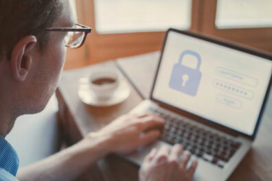 user typing login and password on computer