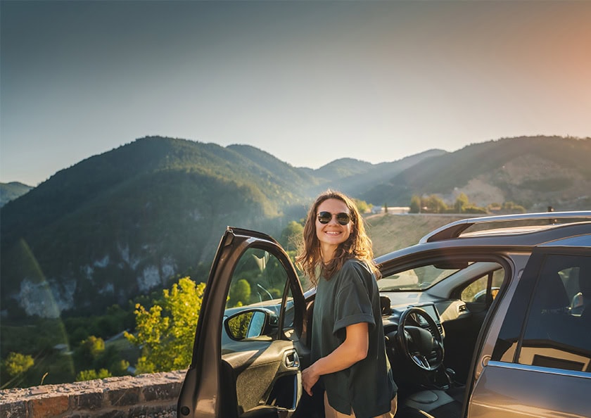 Women getting out of her car to sight see