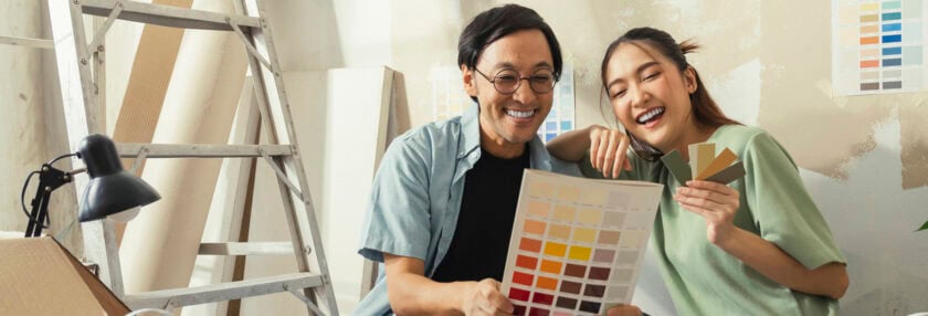 asian lover marry couple sit relax choosing new colour after test paint new colour new apartment home relocation moving in new house,Asia husband wife sit using laptop searching ideas for home decorating sit on floor daytime