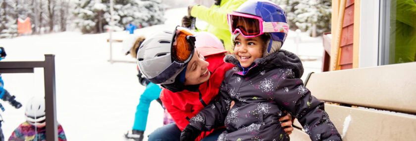Family skiing during an afternoon day