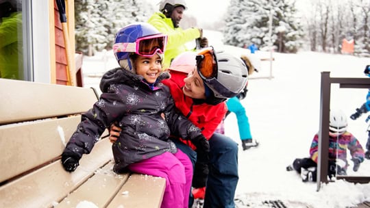 Family skiing during an afternoon day