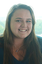 Headshot of Mackenzie Morlock, Jeanne D'Arc Member Service Representative. She is a white woman with long light brown hair. 
