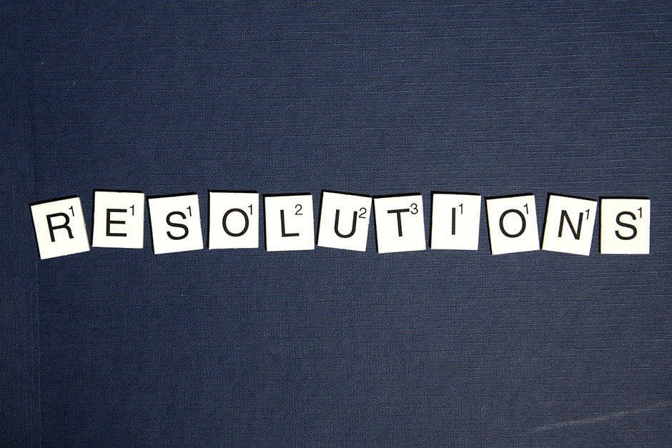 Scrabble piece letters spelling out the word Resolutions