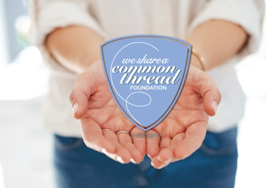 woman holding wsact logo