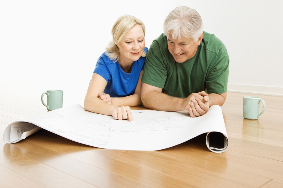 a couple reviews blueprints and plans how to use their personal loan for home renovations