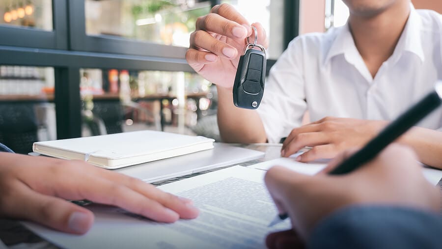 a customer signs a car loan and gets the keys