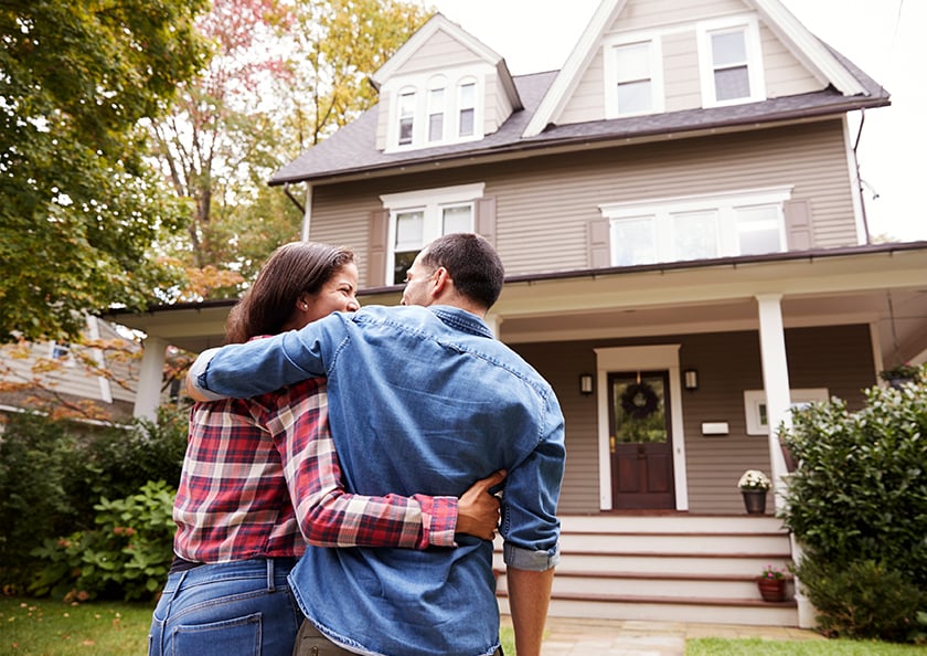 couple-admiring-home-hero