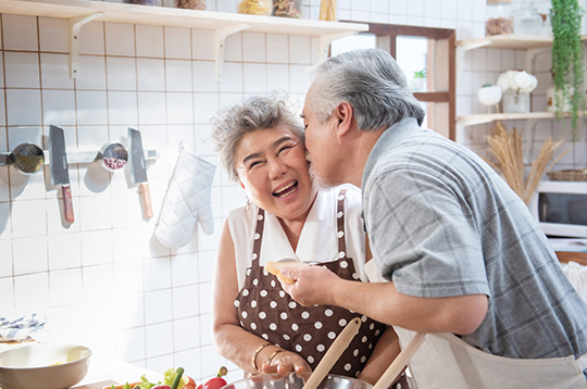 couple-embrace-in-kitchen-refinance-mcti2