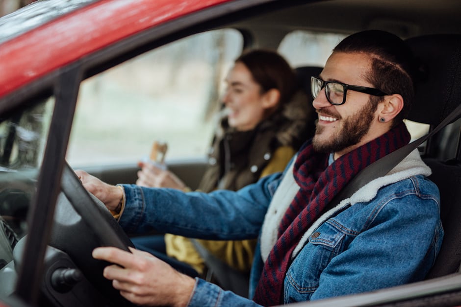 A couple driving in a car