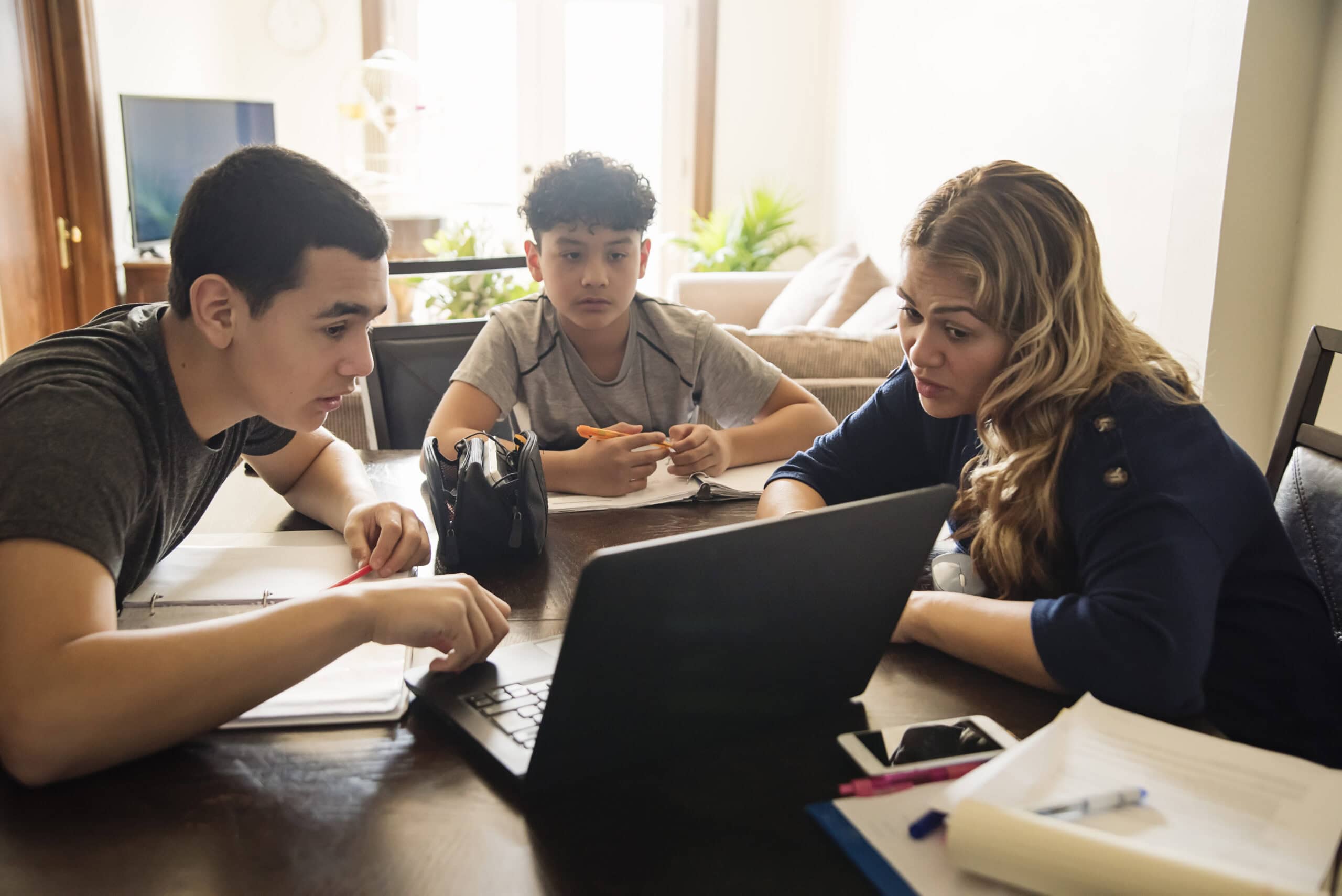 Mother teaching 2 boys