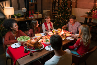 Family toasting on video call with near and dear ones on occasion of Christmas celebration