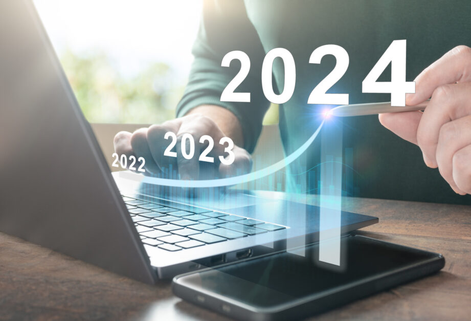 2024 new year. Business plan 2024 new year. Man working on laptop with growth chart 2024. Start new year 2024 with goal plan, goal concept, action plan, strategy, new year business vision.