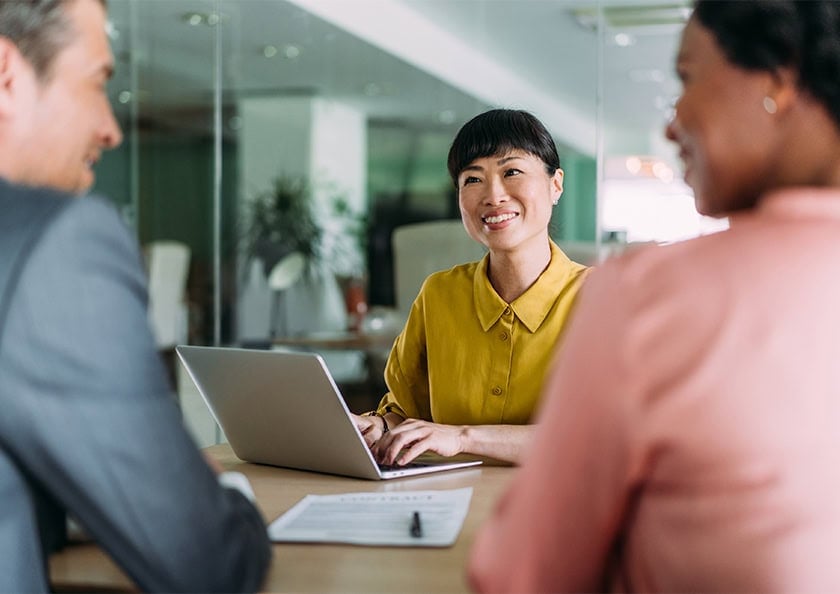 Shot of group of business persons in business meeting. Three entrepreneurs on meeting in board room. Corporate business team on meeting in modern office. Female manager discussing new project with her colleagues. Company owner on a meeting with two of her employees in her office.