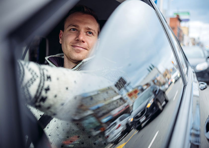 man-driving-with-window-down-hero